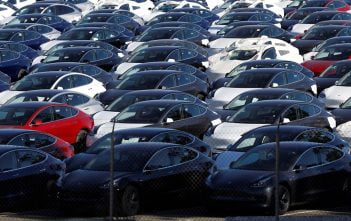 FILE PHOTO: A parking lot of predominantly new Tesla Model 3 electric vehicles is seen in Richmond, California