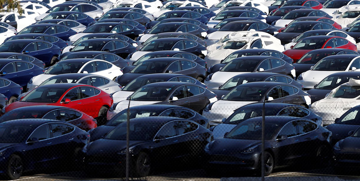 FILE PHOTO: A parking lot of predominantly new Tesla Model 3 electric vehicles is seen in Richmond, California